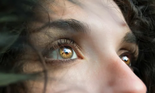 Closeup of a womans brown eyes, symbolizing Eye Movement Desensitization and Reprocessing (EMDR) therapy for trauma.